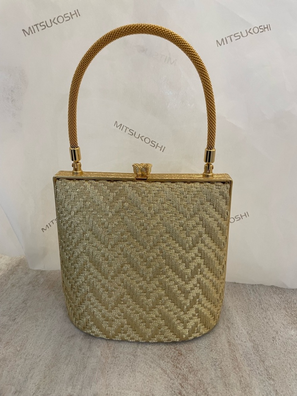 Elegant Gold Woven Handle Handbag by